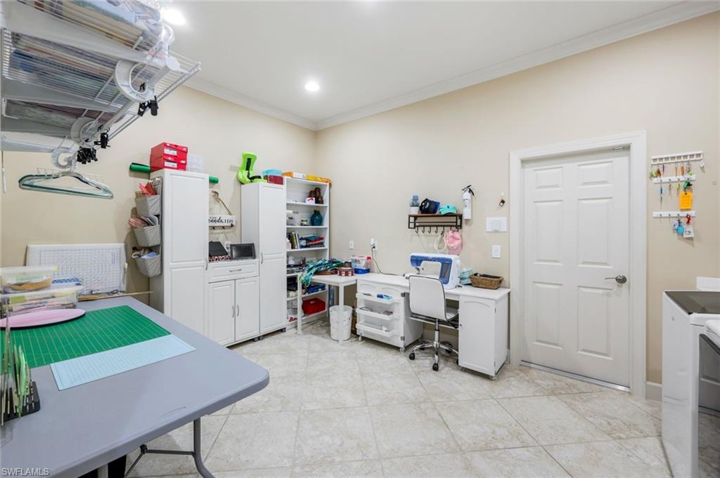 9282 Quarry Drive Naples, FL 34120 - Photo 27 of 50 a room with storage and utility