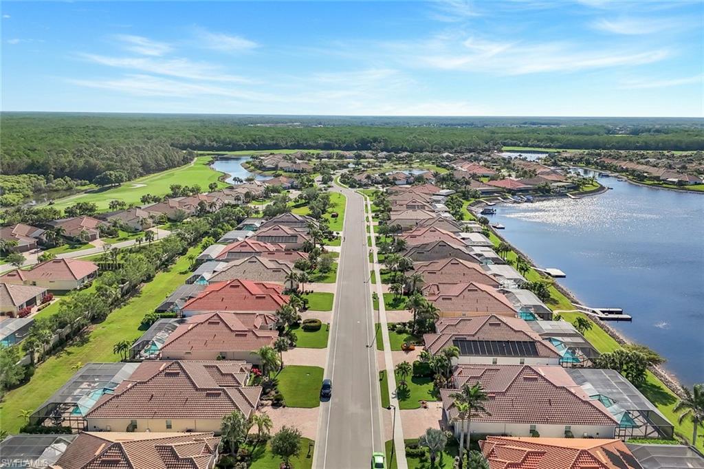 9282 Quarry Drive Naples, FL 34120 - Photo 3 of 50 an aerial view of residential building and lake