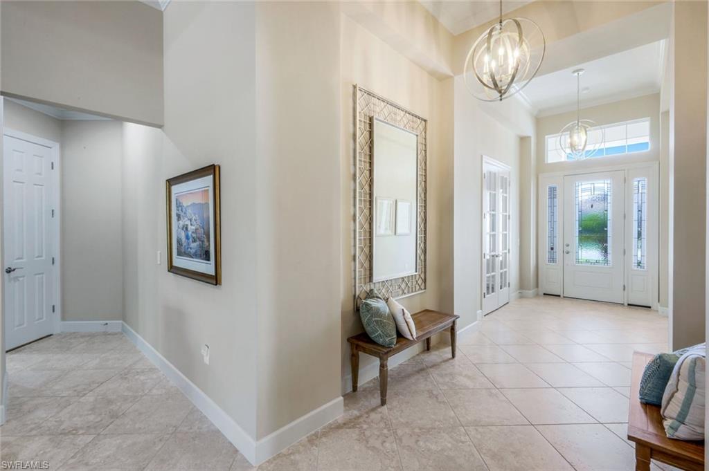 9282 Quarry Drive Naples, FL 34120 - Photo 5 of 50 a view of a hallway with interior of the house