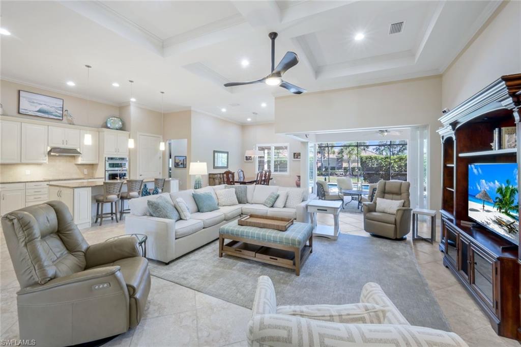 9282 Quarry Drive Naples, FL 34120 - Photo 6 of 50 a living room with furniture and a flat screen tv
