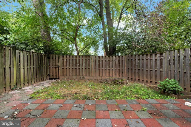 a backyard of a house with green landscape