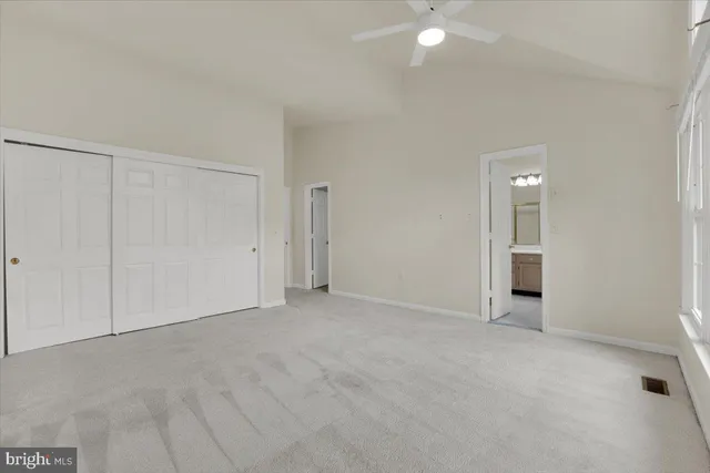 a view of an empty room with a bathroom