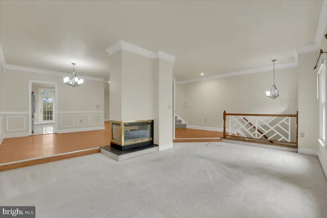 an empty room with large mirror