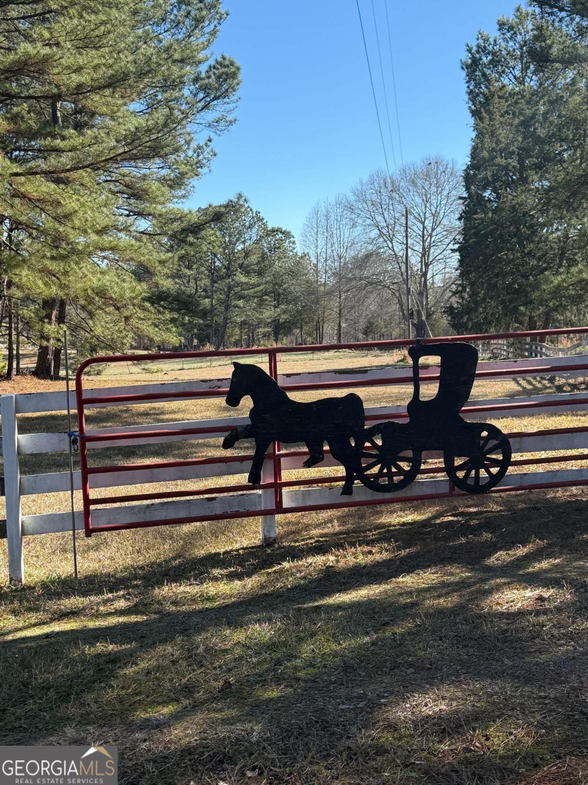670 Jefferies Road Shady Dale, GA 31085 - Photo 2 of 29 a view of a deck with table and chairs a barbeque with wooden fence
