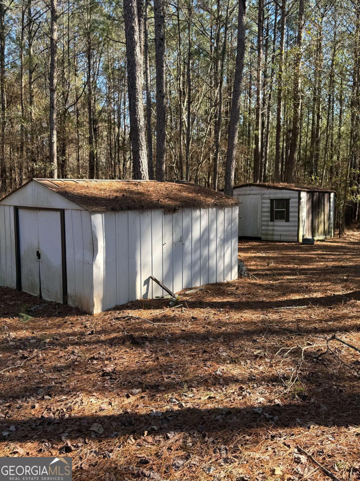 670 Jefferies Road Shady Dale, GA 31085 - Photo 27 of 29 a backyard of a house