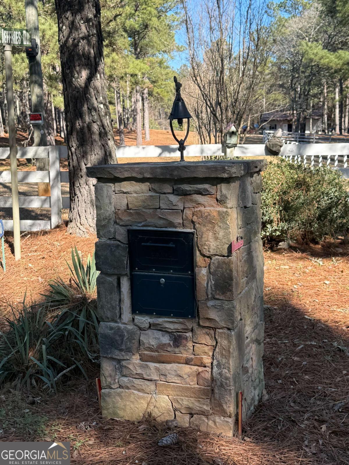670 Jefferies Road Shady Dale, GA 31085 - Photo 3 of 29 a large tree in front of a house