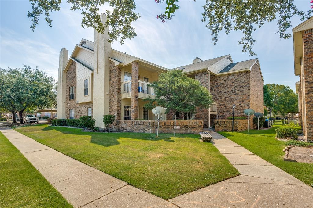 3110 Devonshire Drive, Unit 117 Plano, TX 75075 - Photo 1 of 13 a view of a building with a garden and plants