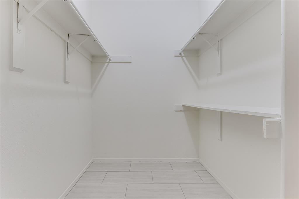 3110 Devonshire Drive, Unit 117 Plano, TX 75075 - Photo 10 of 13 a view of an empty walk in closet