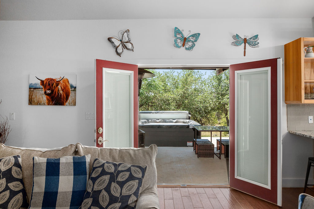 13326 Trautwein Road Austin, TX 78737 - Photo 12 of 40 a bedroom with furniture and a window