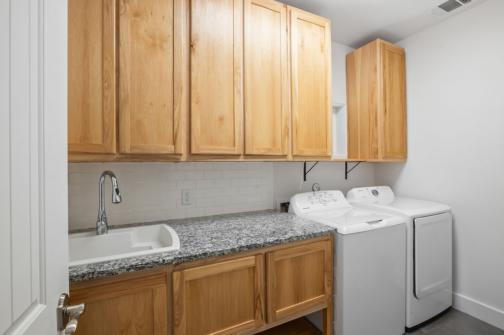 13326 Trautwein Road Austin, TX 78737 - Photo 27 of 40 a utility room with dryer and washer