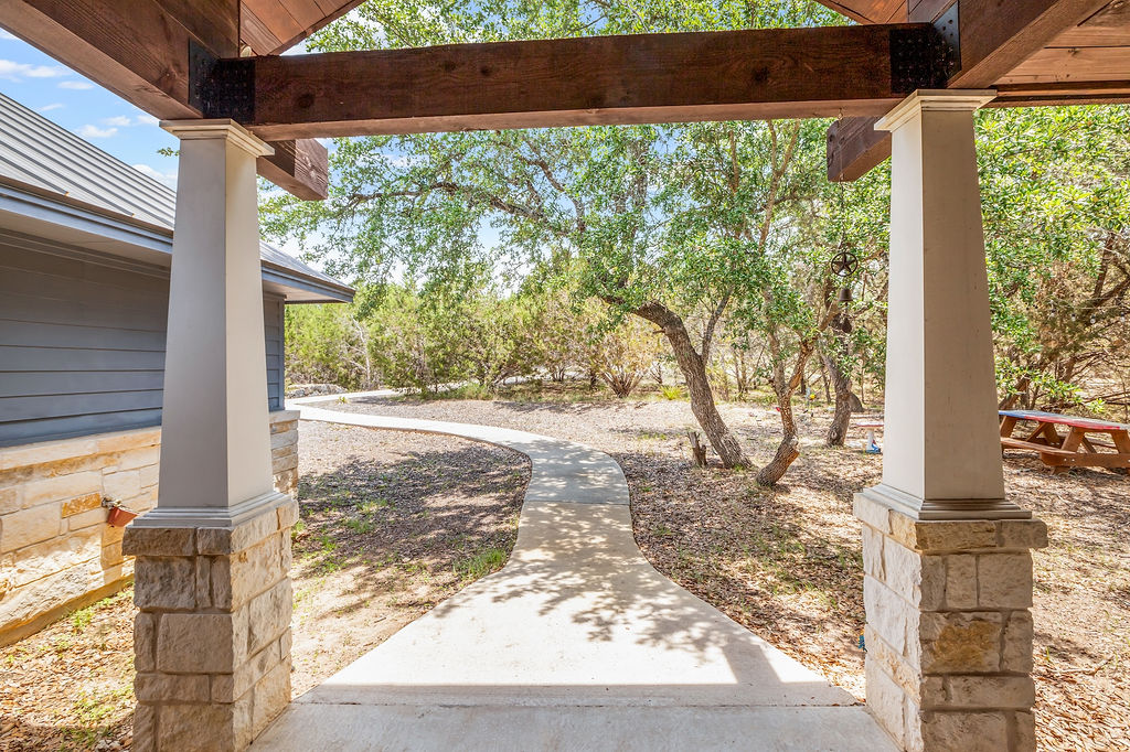 13326 Trautwein Road Austin, TX 78737 - Photo 3 of 40 a view of a yard with an outdoor space