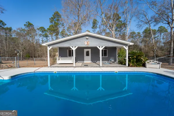 a view of a room with wooden floor and window