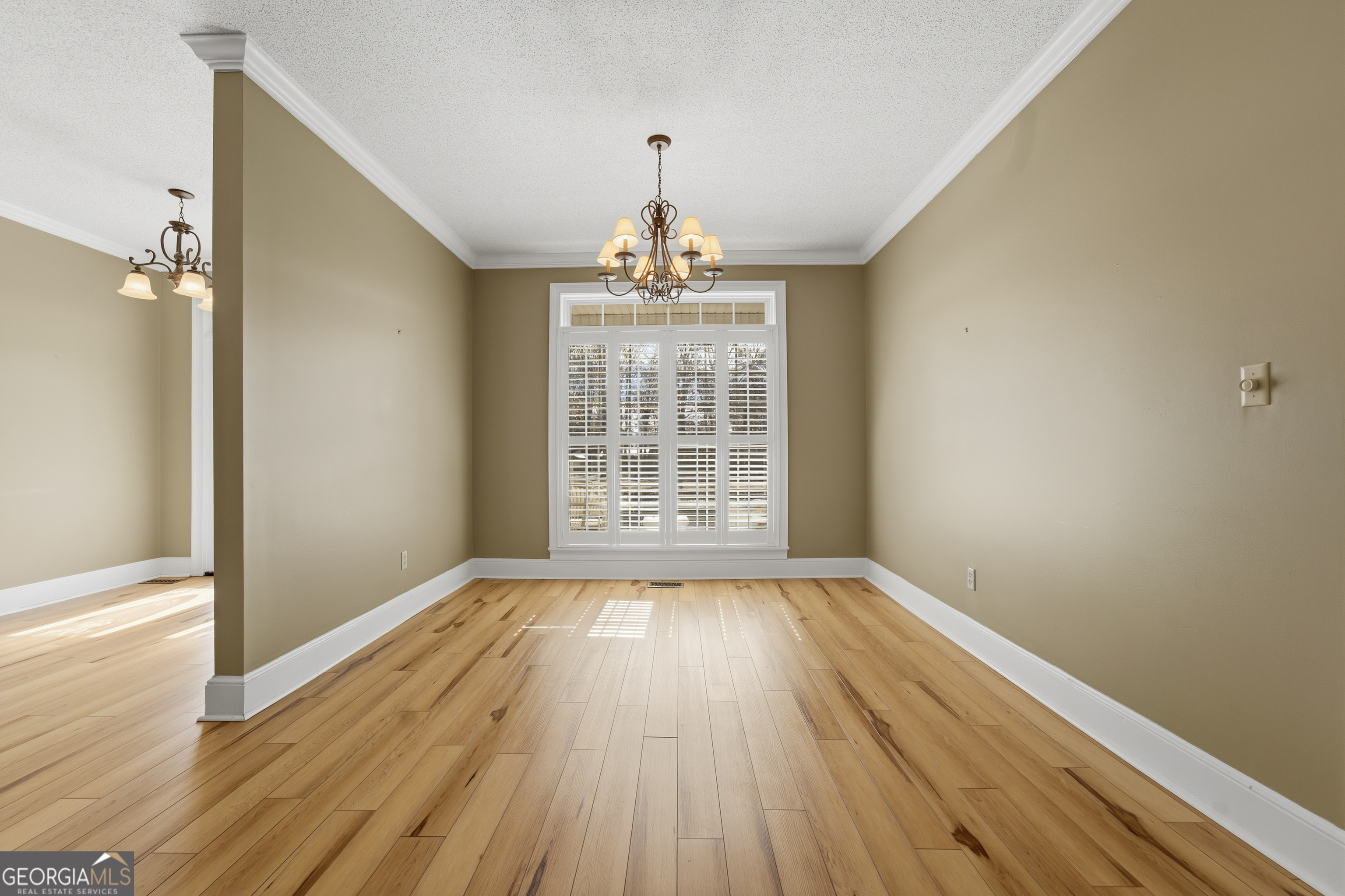 134 Patrick Street Swainsboro, GA 30401 - Photo 17 of 57 wooden floor in an empty room with a window