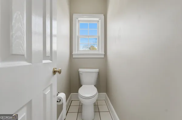 a view of a livingroom with furniture and a window