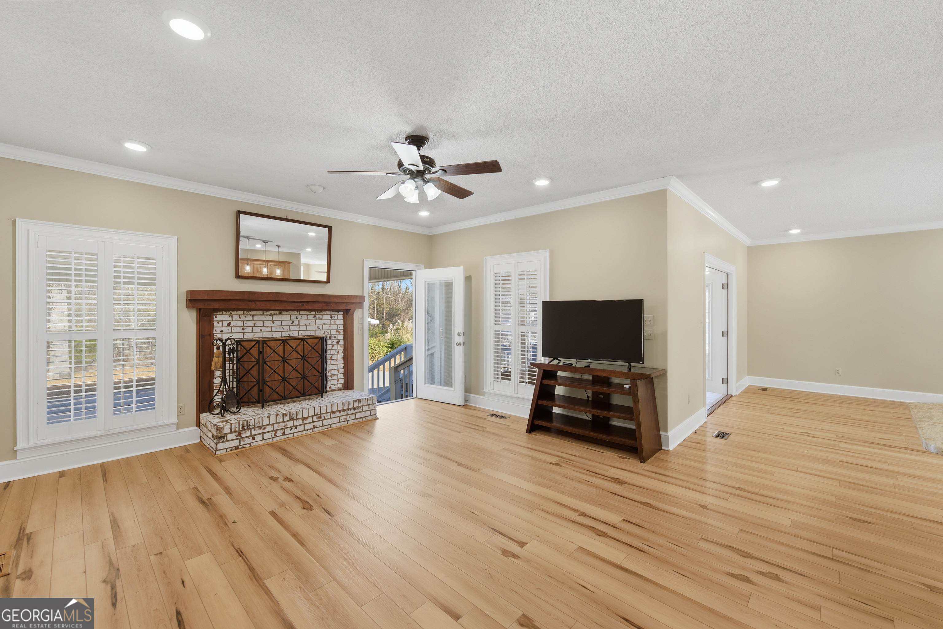 134 Patrick Street Swainsboro, GA 30401 - Photo 35 of 57 a living room with furniture and a fireplace