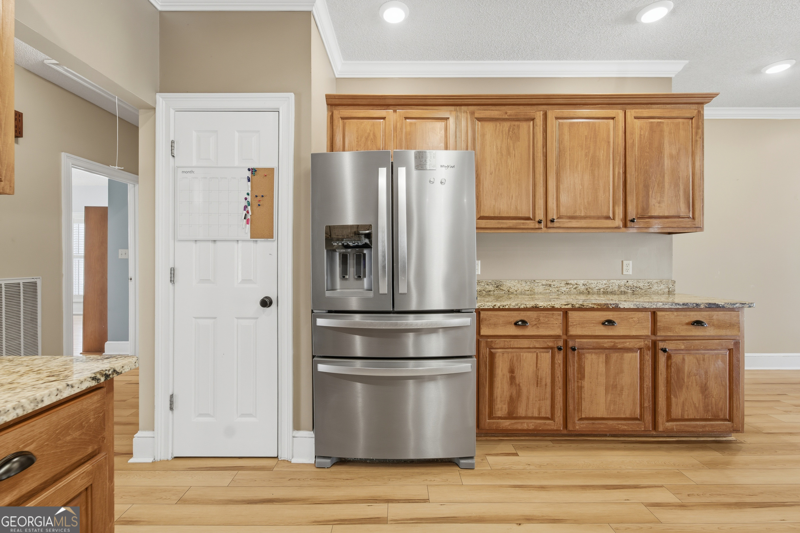 134 Patrick Street Swainsboro, GA 30401 - Photo 40 of 57 a kitchen with granite countertop a refrigerator stove and cabinets