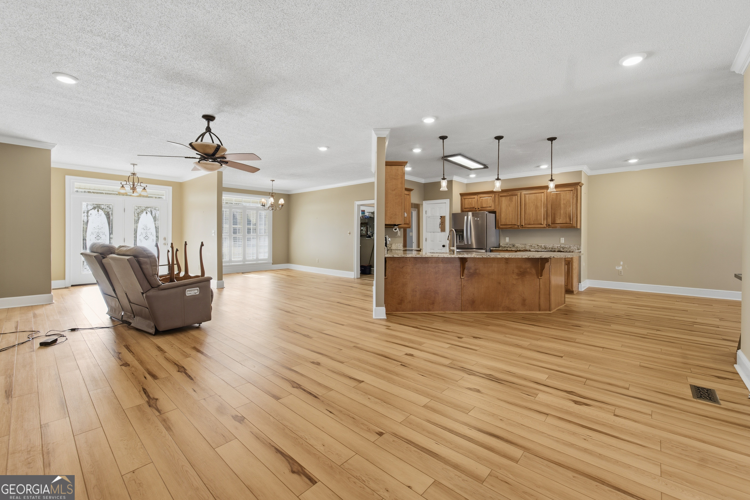 134 Patrick Street Swainsboro, GA 30401 - Photo 42 of 57 a view of a living room a kitchen and a wooden floor