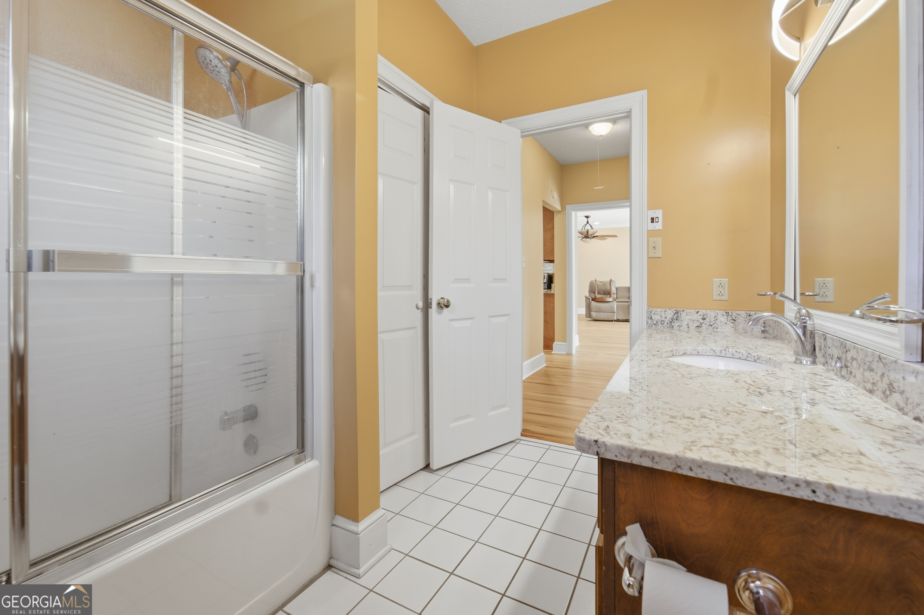 134 Patrick Street Swainsboro, GA 30401 - Photo 52 of 57 a bathroom with a granite countertop sink and shower