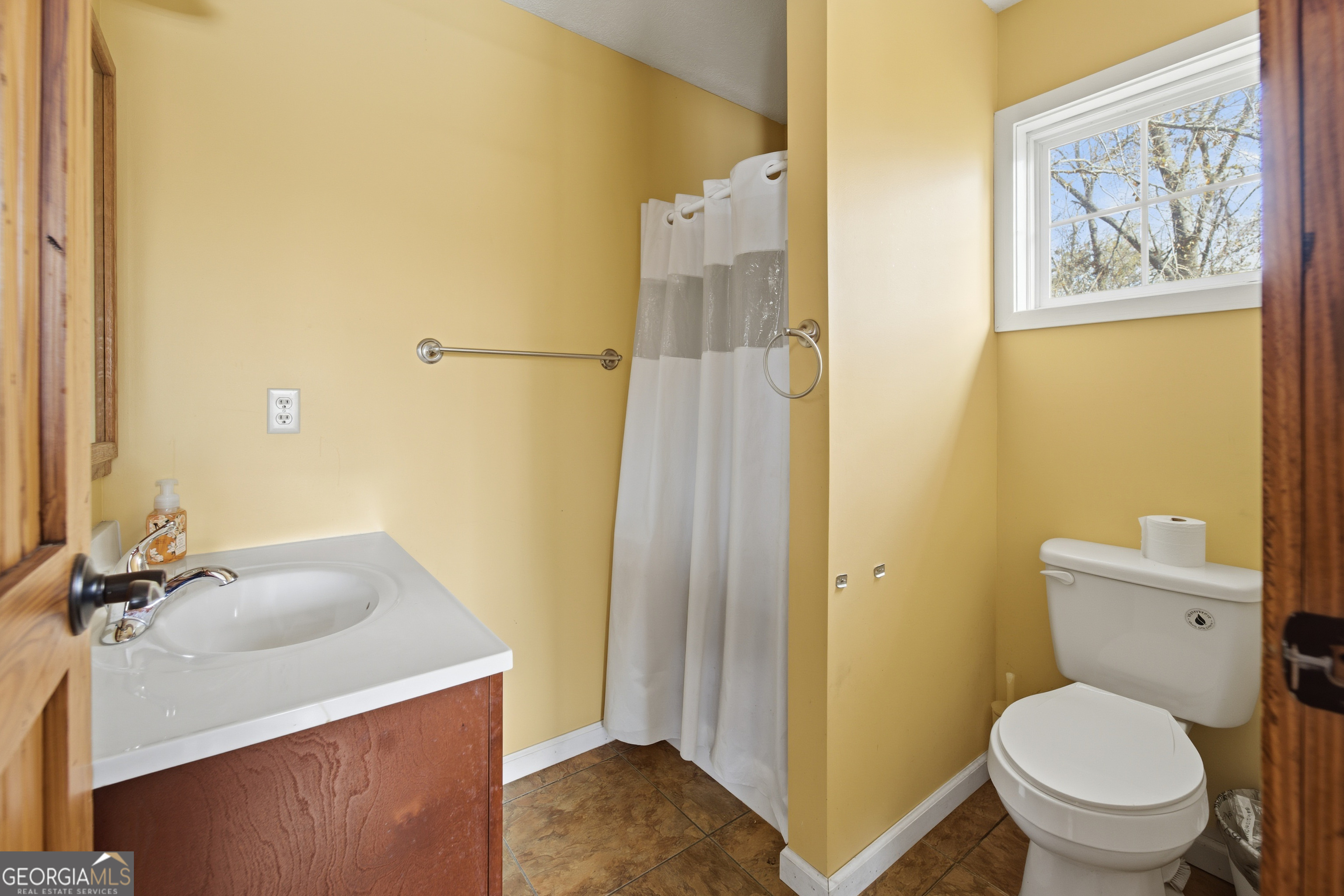 134 Patrick Street Swainsboro, GA 30401 - Photo 57 of 57 a bathroom with a sink a toilet and shower