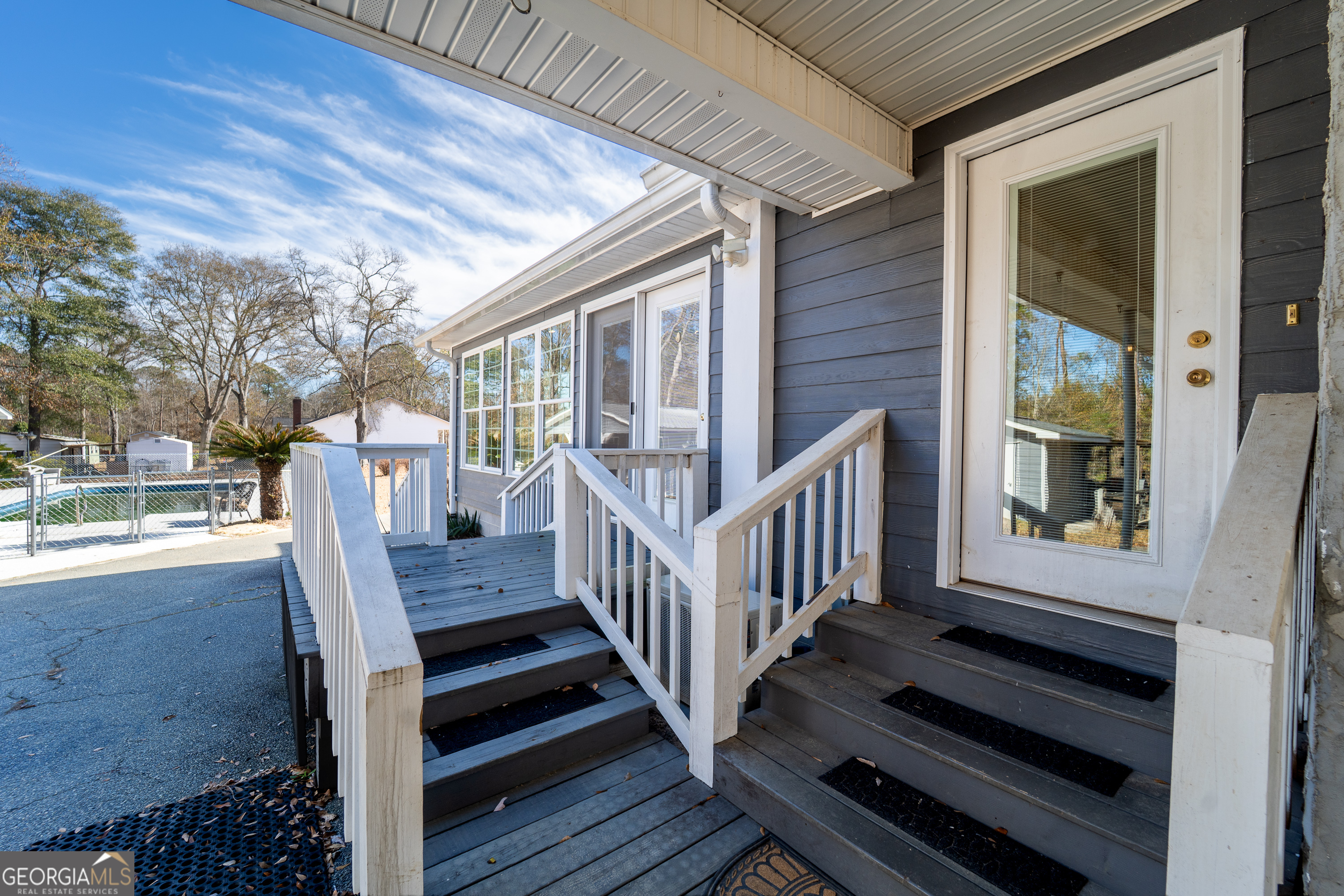 134 Patrick Street Swainsboro, GA 30401 - Photo 7 of 57 a view of a wooden chairs on the deck