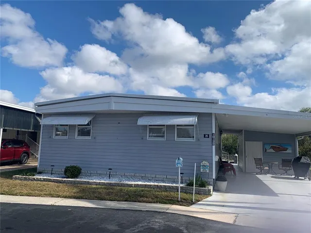 a view of a brick house with many windows