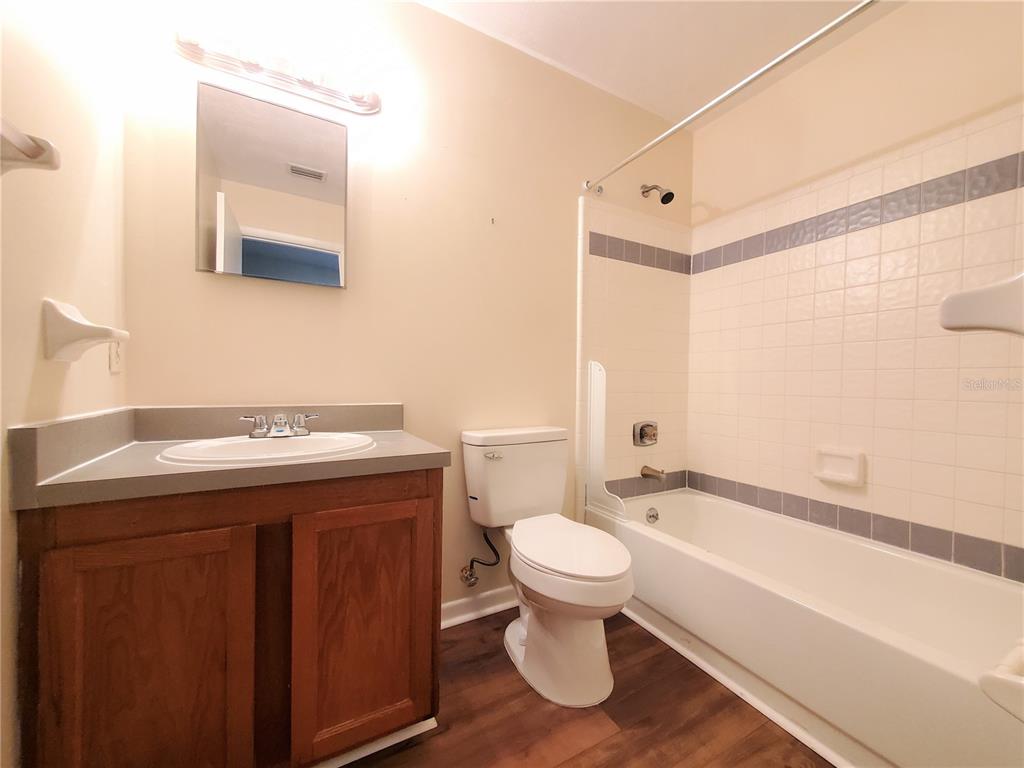 2127 Southwest 39 Drive Gainesville, FL 32607 - Photo 11 of 16 a bathroom with a sink toilet and shower