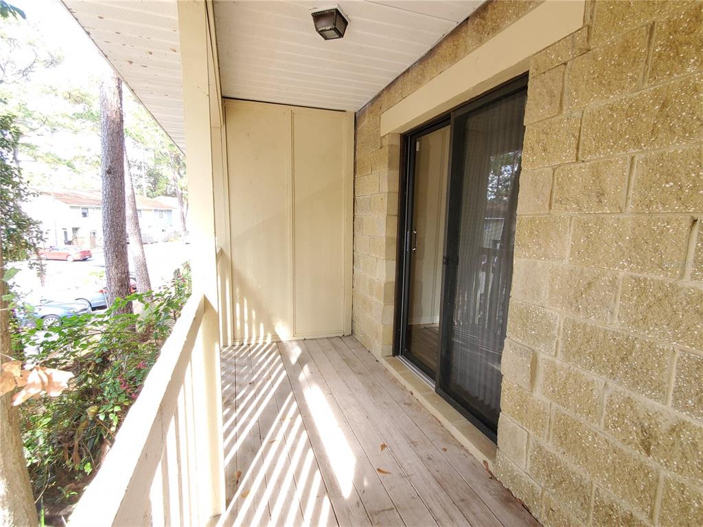 2127 Southwest 39 Drive Gainesville, FL 32607 - Photo 16 of 16 a view of a bedroom with wooden floor and natural light
