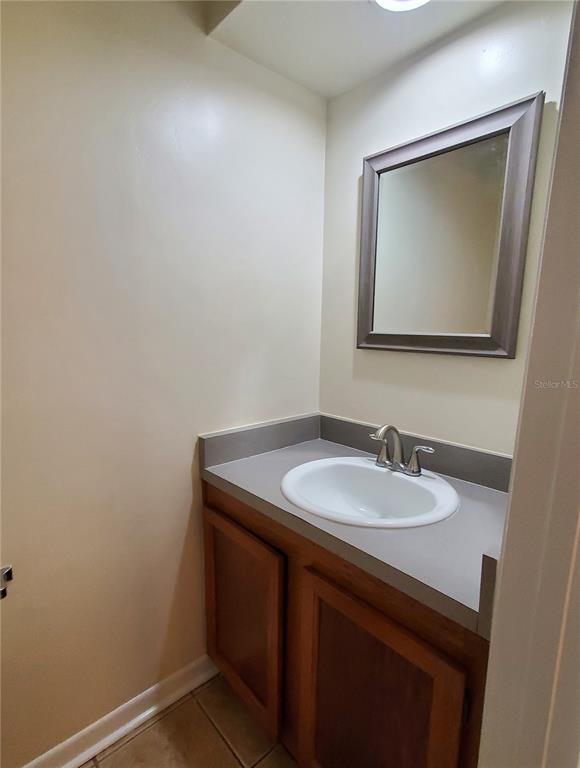 2127 Southwest 39 Drive Gainesville, FL 32607 - Photo 4 of 16 a bathroom with a sink and a mirror