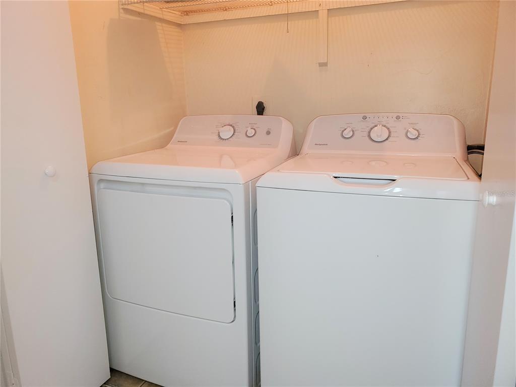 2127 Southwest 39 Drive Gainesville, FL 32607 - Photo 7 of 16 a utility room with dryer and washer