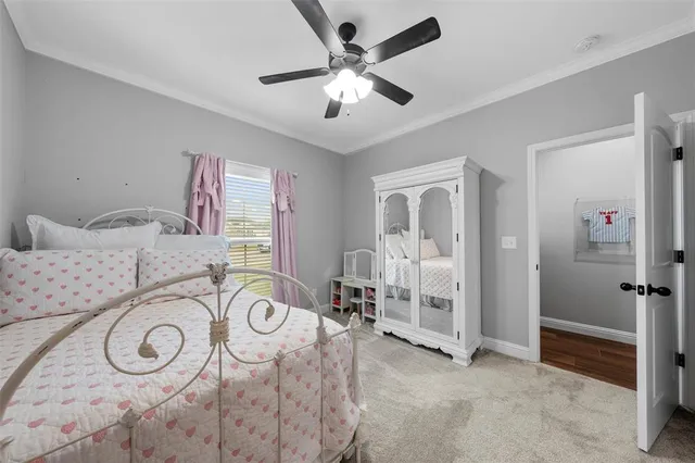 a view of a livingroom with furniture and a chandelier fan