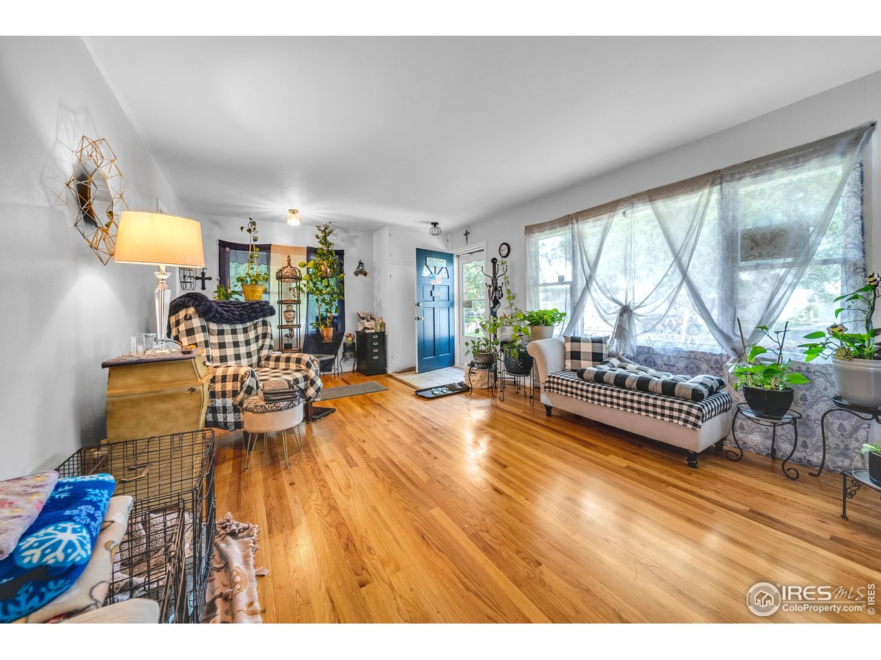 714 Delmar Street Sterling, CO 80751 - Photo 7 of 22 a living room with furniture and a table