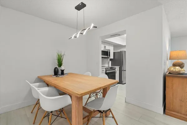 a view of a dining room with furniture