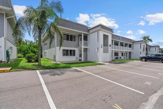 a city street lined with buildings and trees