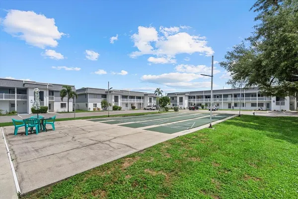 a view of house with a garden