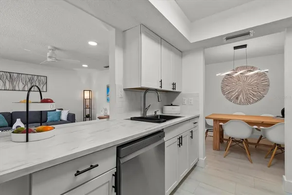 a kitchen with a sink cabinets and window