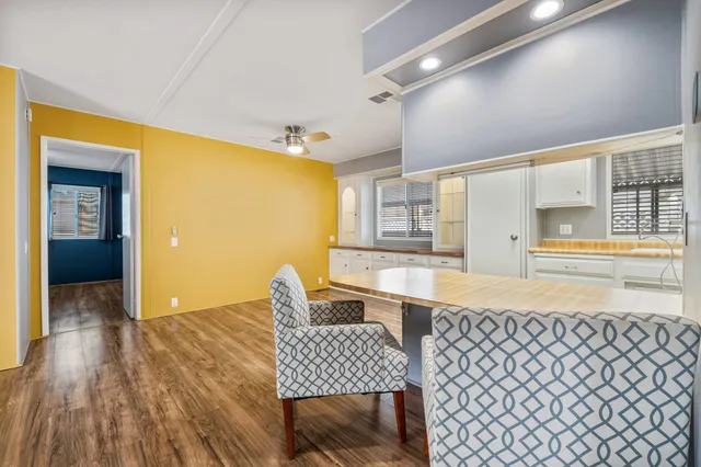 a dining room with furniture and window