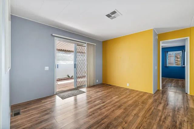 a view of an empty room with a window