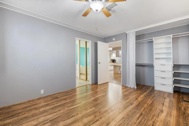 a bathroom with a shower and a sink