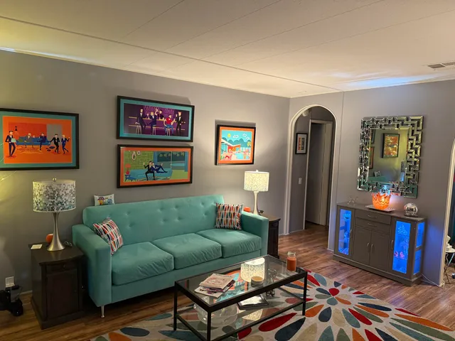 a living room with furniture and a large window