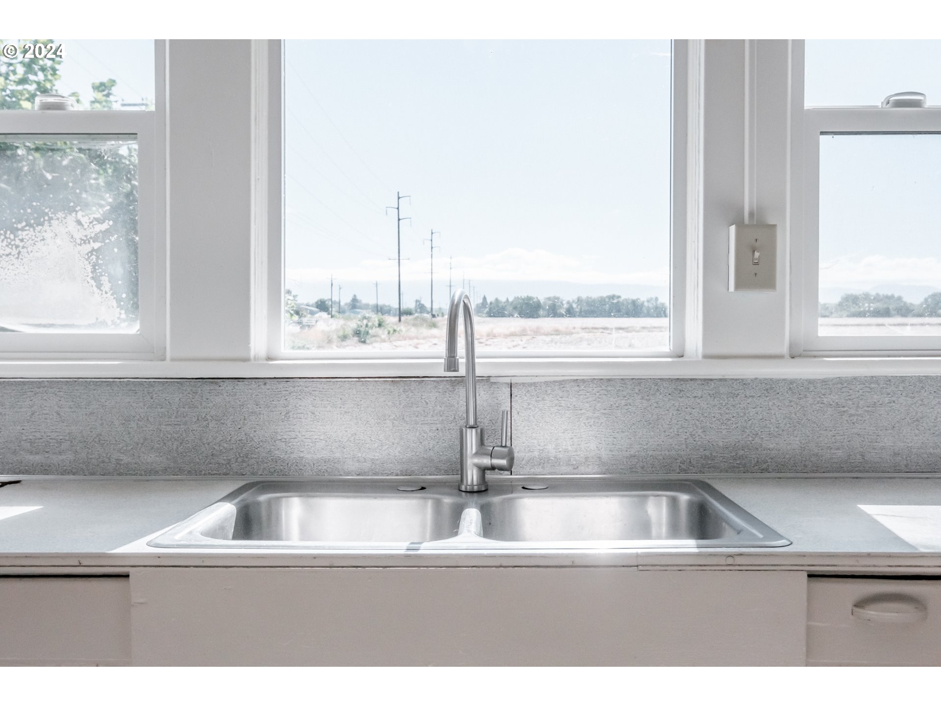 28766 Highway 36 Junction City, OR 97448 - Photo 20 of 36 a kitchen with a sink and a window