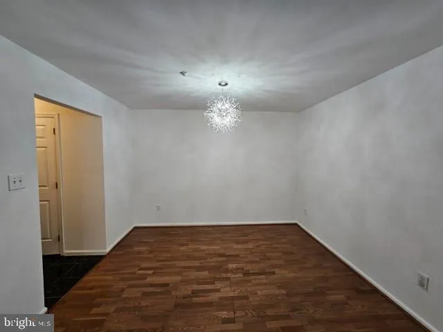 a kitchen with a refrigerator a stove a microwave and cabinets