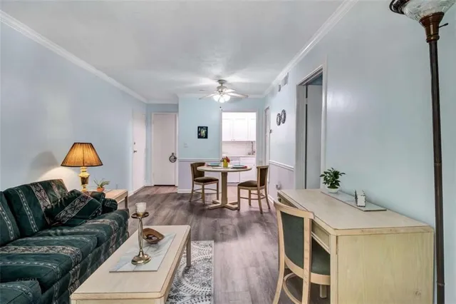 a living room with furniture a dining table and a fireplace