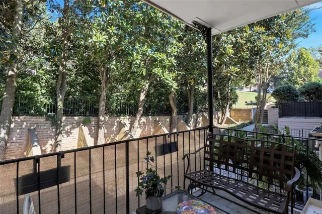 a view of a balcony with a trees