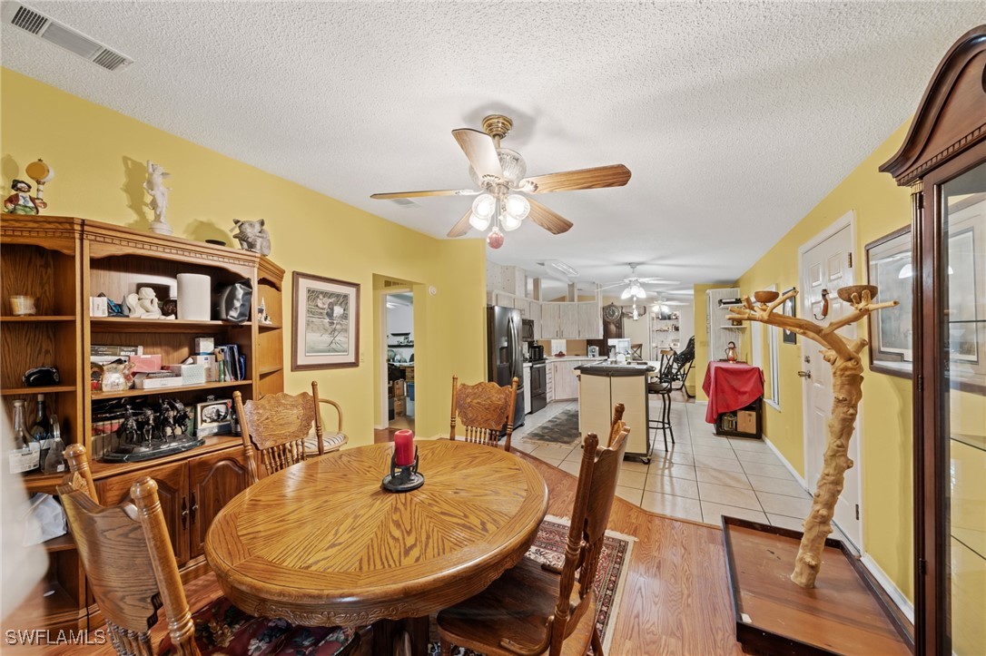 919 Manatee Road Naples, FL 34114 - Photo 13 of 32 a view of a dining room with furniture