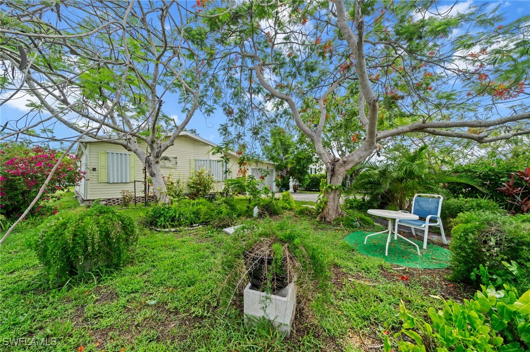 919 Manatee Road Naples, FL 34114 - Photo 32 of 32 a garden view with a seating space