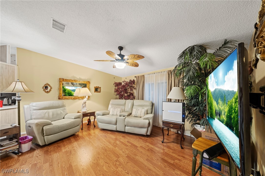919 Manatee Road Naples, FL 34114 - Photo 4 of 32 a living room with furniture and a large window