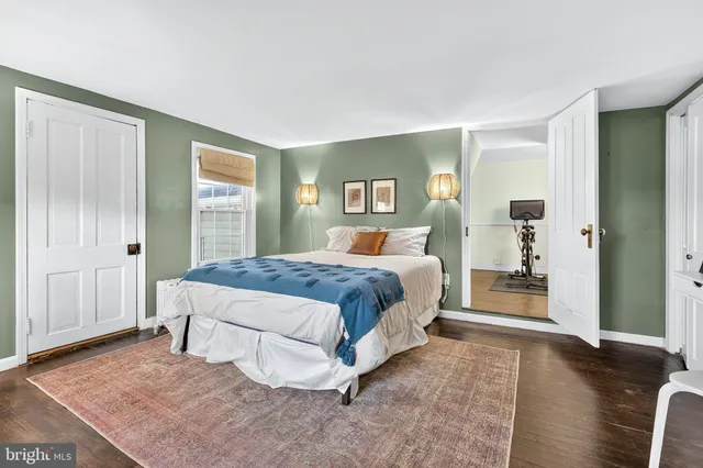 a bedroom with a bed and a table