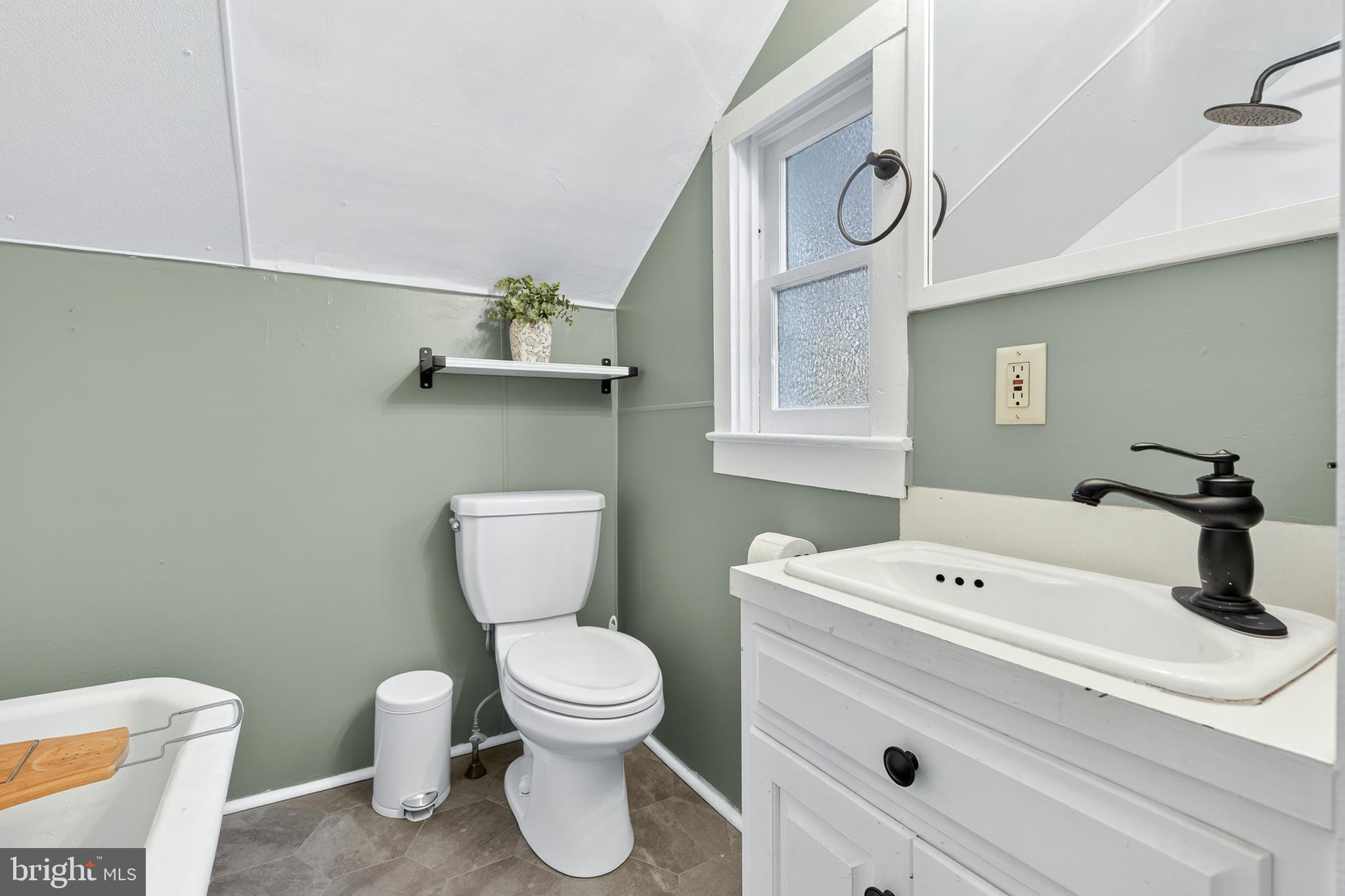 130 East High Street Manheim, PA 17545 - Photo 22 of 34 a bathroom with a sink a toilet and a mirror