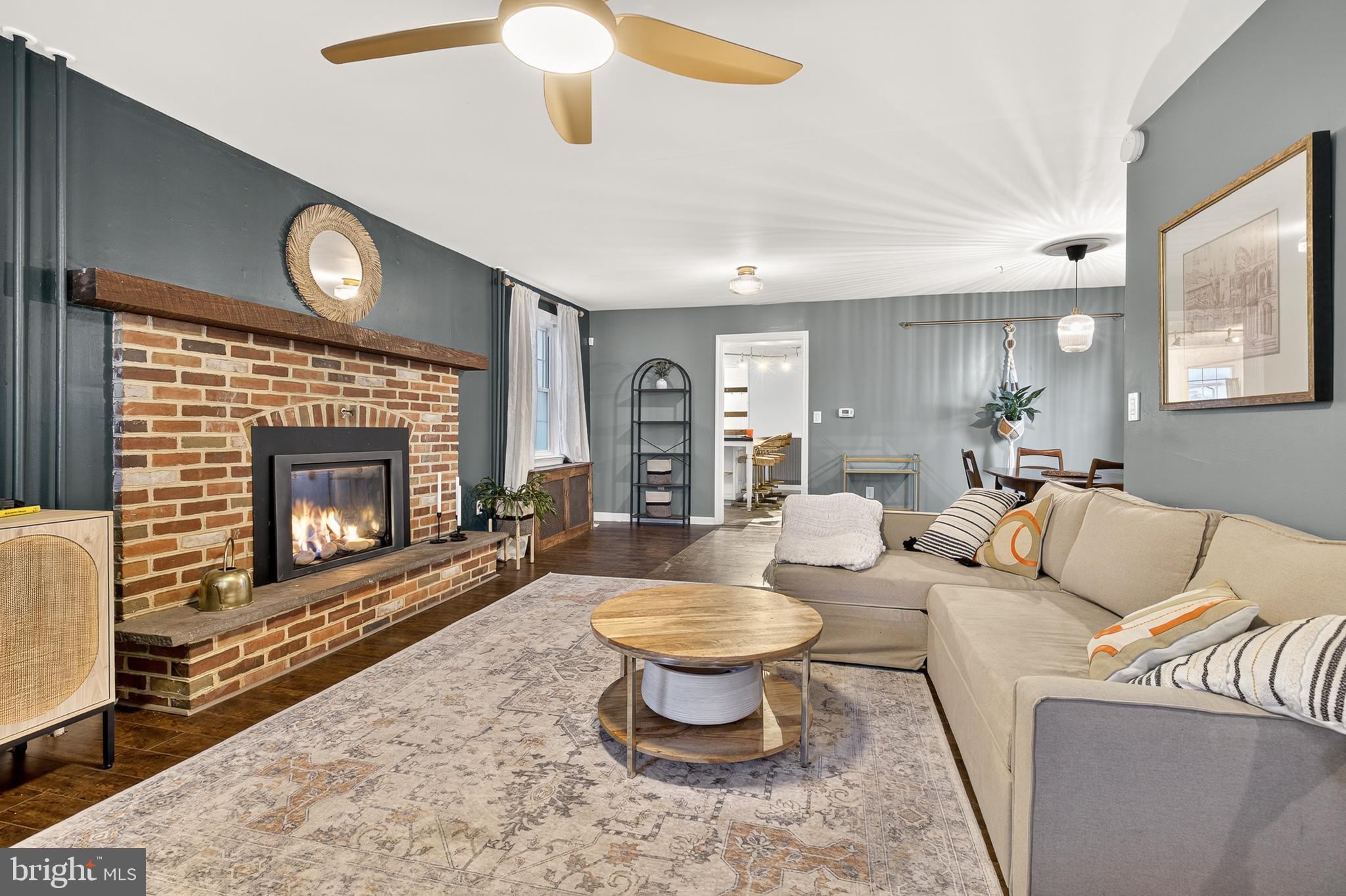 130 East High Street Manheim, PA 17545 - Photo 3 of 34 a living room with furniture a fireplace and a large window
