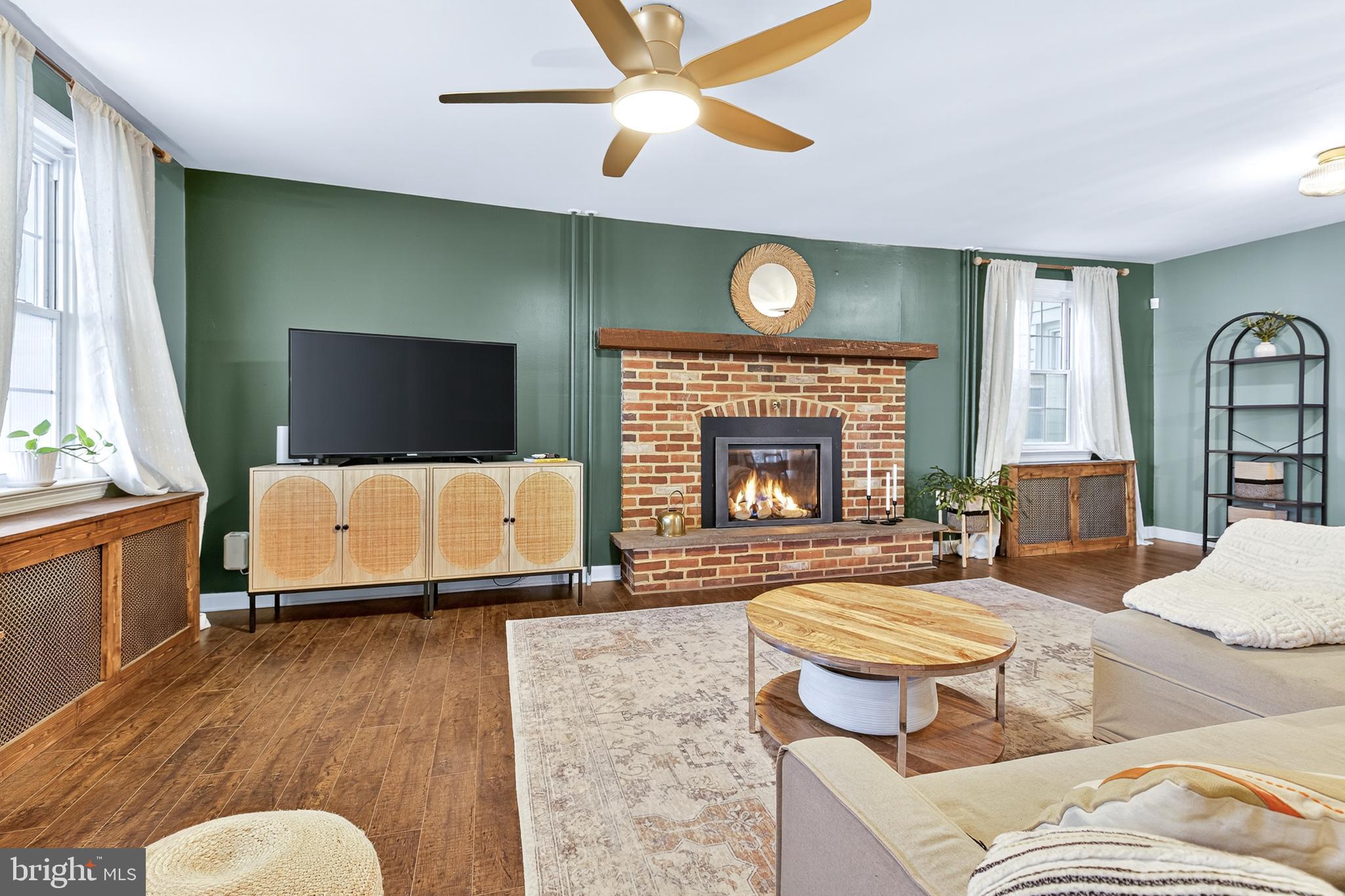 130 East High Street Manheim, PA 17545 - Photo 4 of 34 a living room with furniture and a fireplace